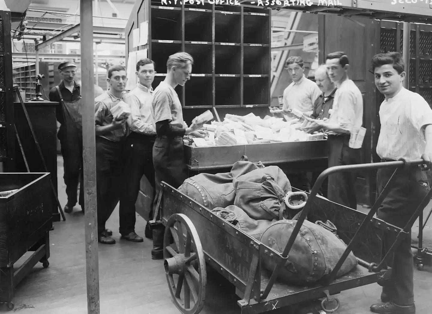 Postal workers sorting parcels in a New York post office, 1914